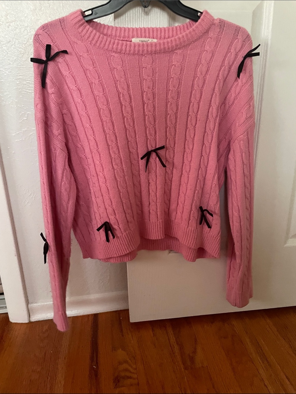 Timing Pink Cable-Knit Crewneck Sweater with Black Bow Accents